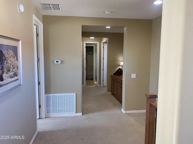Hall to 3 more bedrooms and Media Room