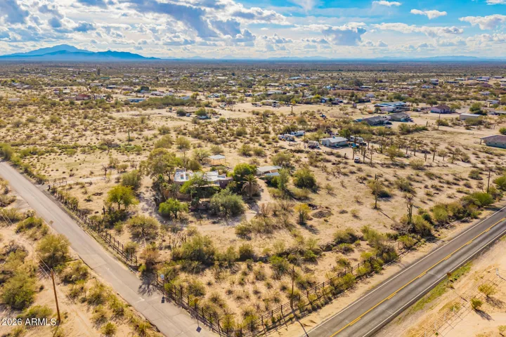 The ariel view shows Cactus Forest Rd and Dead Man's Gulch Intersection as the home sits.