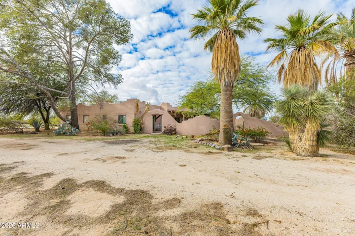 The property is surrounded by mature trees for extra privacy.