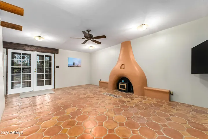 Beehive fireplaces to warm up the living room. French doors to back patio.