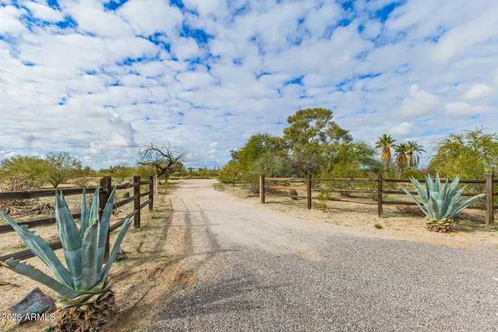 The house has a beautiful split rail fence.