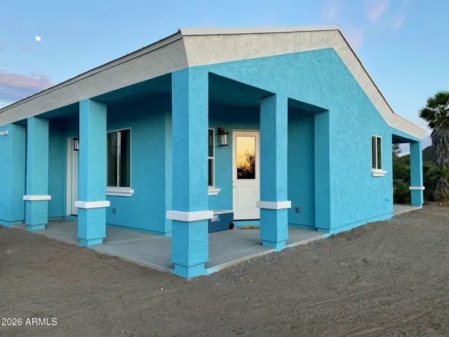 Front door and porch, side door