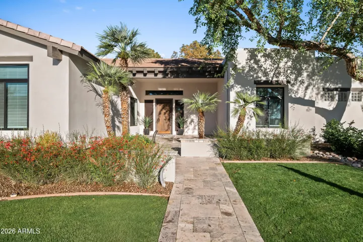 Professionally updated Scottsdale landscaping with modern hardscape, stone pathways, and low-maintenance design. Enhances outdoor living and overall property value.