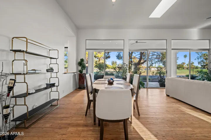 Elegant dining area in Scottsdale with natural light, open layout, and views of the backyard. Ideal for gatherings with seamless connection to outdoor living.