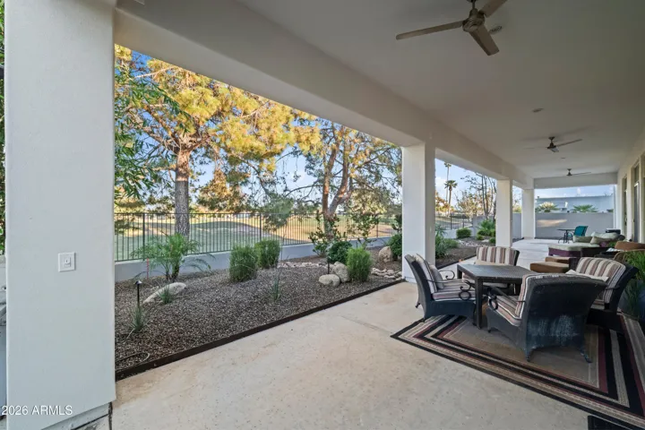 Scottsdale outdoor living space with shaded patio, comfortable seating, and desert landscaping. Relaxing setting designed for year-round enjoyment and seamless indoor-outdoor flow.