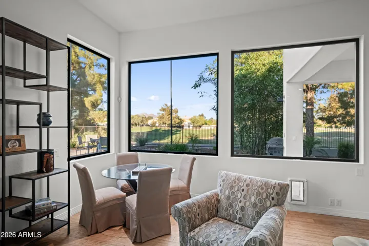 Comfortable Scottsdale sitting area featuring large windows, natural light, and views of the backyard. Perfect for relaxing or casual gatherings.