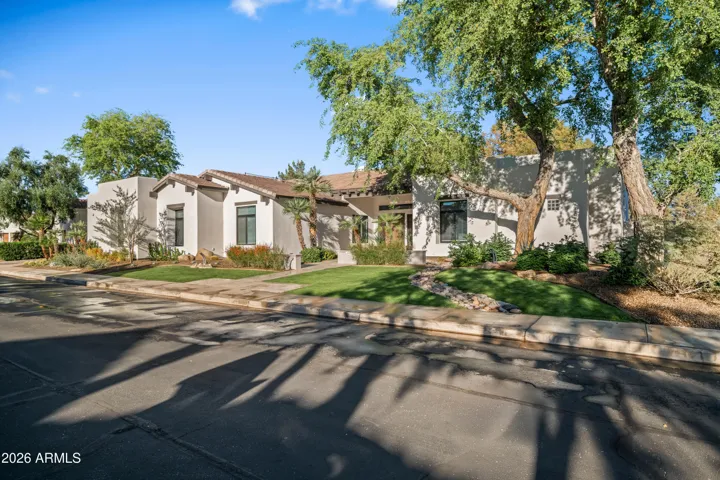 Sunlit Scottsdale property with expansive windows and thoughtfully designed exterior. Energy-conscious features and natural light enhance comfort and efficiency in this beautifully maintained home.