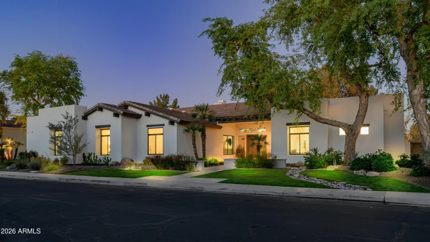 Exceptional curb appeal with clean architectural lines, lush greenery, and updated landscaping. This Scottsdale home stands out with its modern desert design and inviting presence.