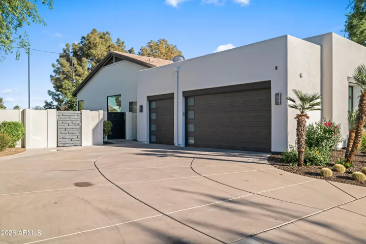 Spacious 3-car garage with extended length design, direct access, and electric vehicle charging capability. Perfect for modern Scottsdale living with ample storage and parking flexibility.
