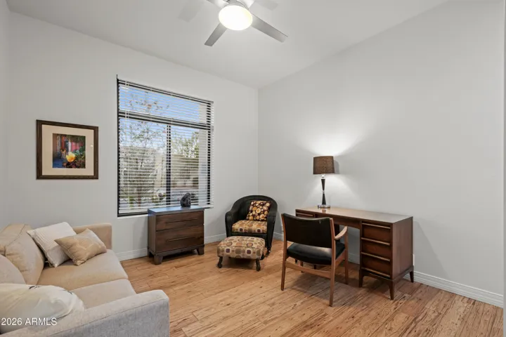 Scottsdale flex space staged as a sitting room, ideal for guests, office, or relaxation area. Features wood flooring and natural light.