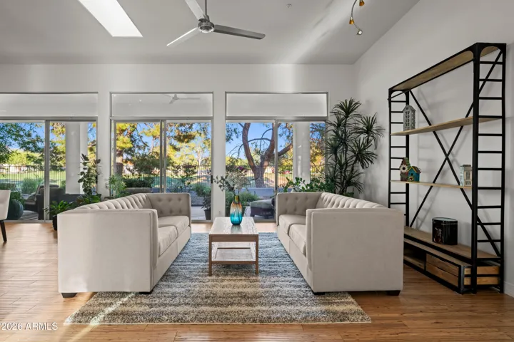 Bright Scottsdale living space featuring large windows, modern finishes, and open layout. Designed for comfort and entertaining with views of landscaped outdoor areas.