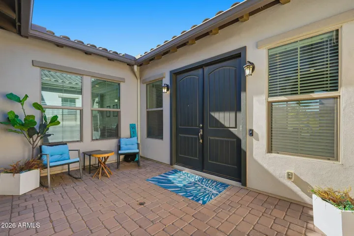 Take a Moment to enjoy this Entry Courtyard which is another space for entertaining