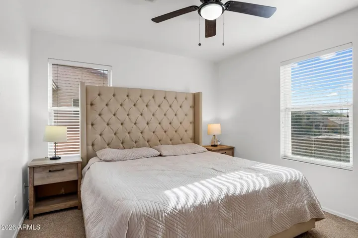 Primary bedroom with a ceiling fan & light combo