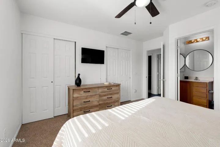 Primary bedroom with his & hers closets