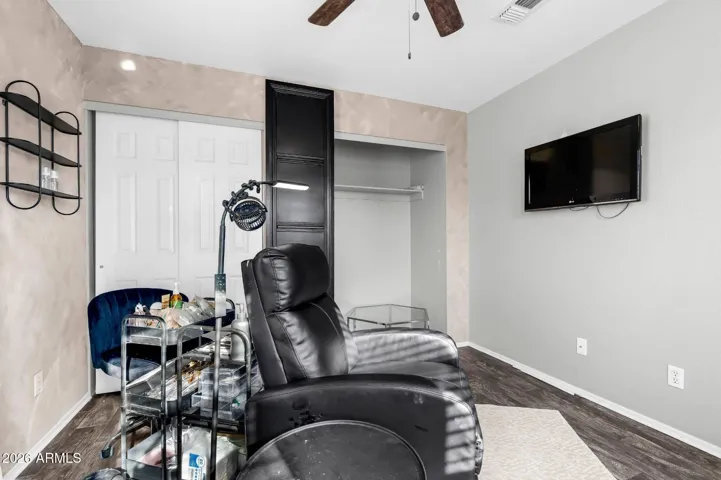 Bedroom 3, a black sliding door conceals shelving on the opposite side