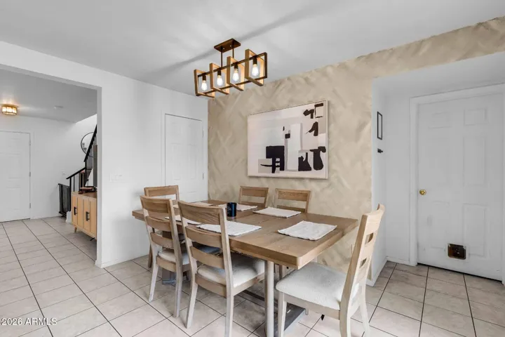 Dining area with newer light fixture
