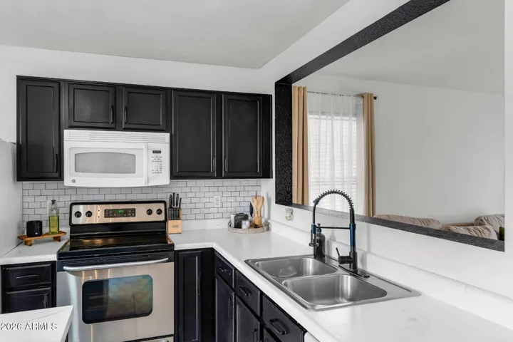 Kitchen island features vertical fluted paneling