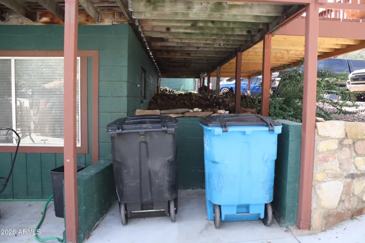 Trash storage under custom Trash Chute through deck