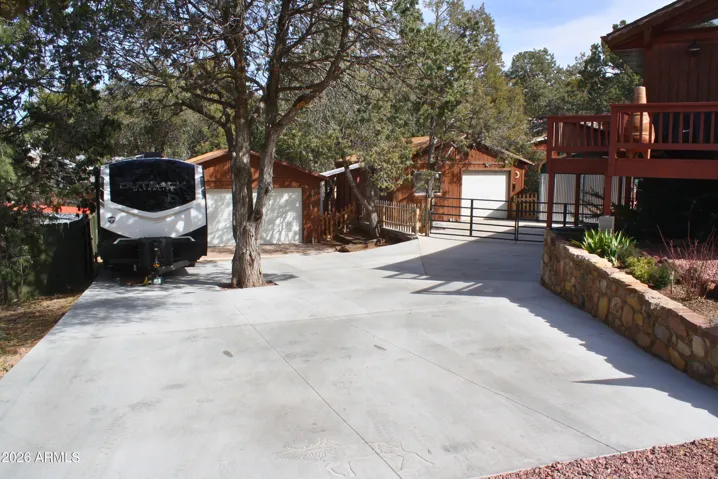 Newly paved driveway to multiple garages as well as RV space