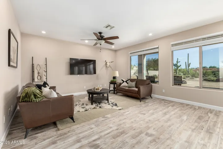 Light-filled living area with large windows showcasing desert views.