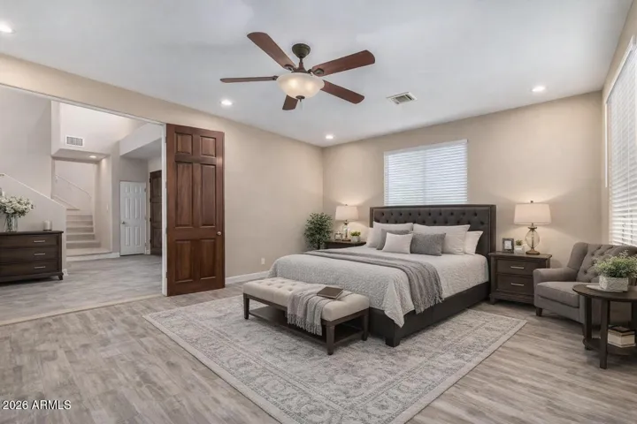 Thoughtfully staged as a serene primary retreat, this suite offers generous space, soft neutral tones, and a layout that blends functionality with everyday luxury.