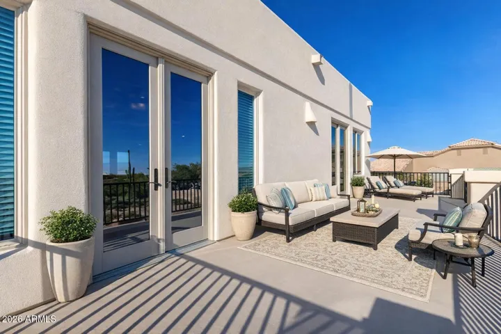 Spacious outdoor patio with comfortable seating, perfect for relaxing or entertaining.