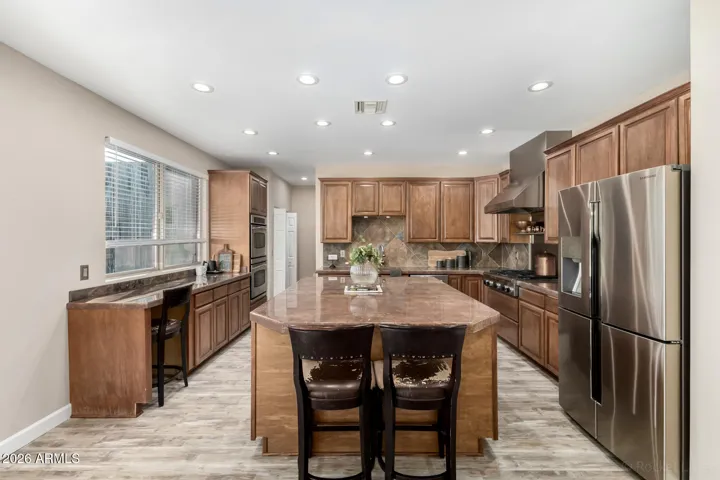 Expansive kitchen with oversized island, perfect for cooking and gathering.