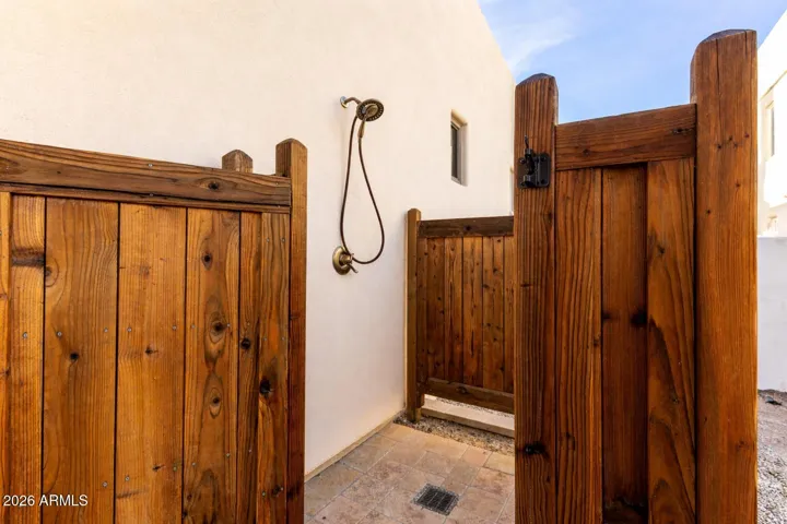 Private outdoor shower with rustic wood enclosure—perfect for rinsing off after outdoor activities.