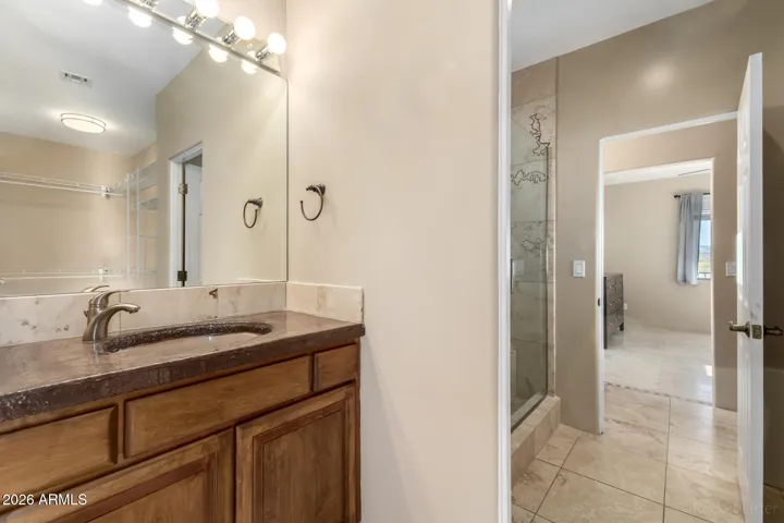 Well-appointed bathroom with seamless flow to the adjacent bedroom.