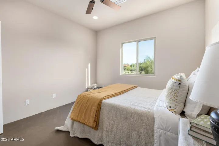 Cozy bedroom with natural light and a warm, inviting atmosphere.