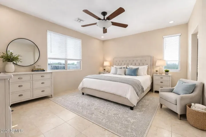 Bright secondary bedroom with neutral tones and flexible layout.