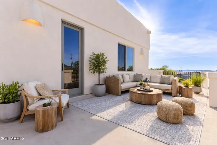 Stylish outdoor lounge with cozy seating, perfect for relaxing or entertaining.
