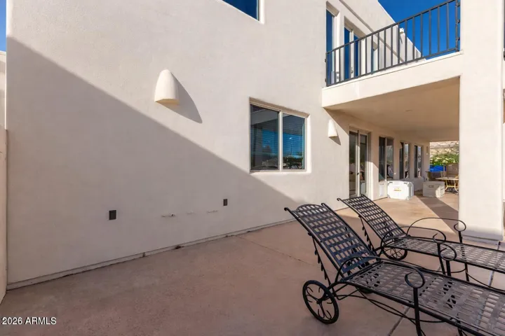 Expansive covered patio offering shaded outdoor living space.
