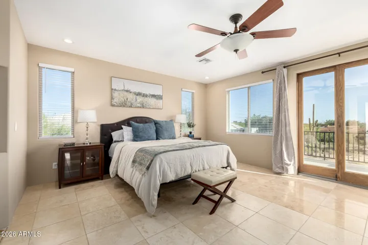 Private retreat with direct access to a balcony and scenic views.