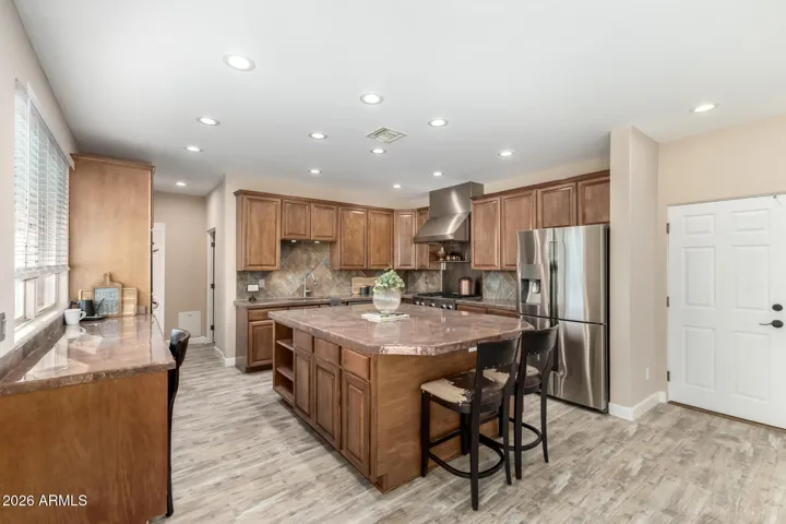 Expansive kitchen with oversized island, perfect for cooking and gathering.
