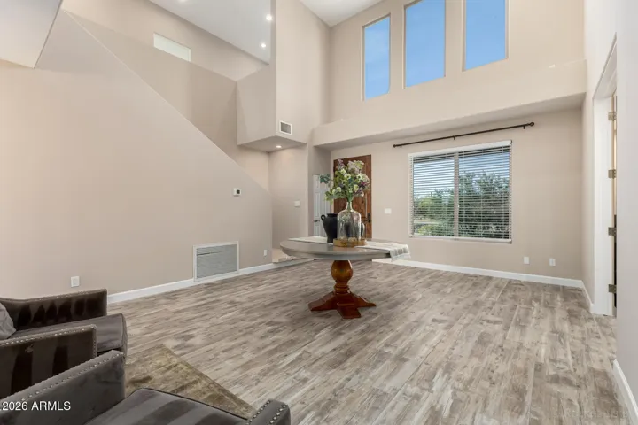 Grand entry space with soaring ceilings and flexible living potential.