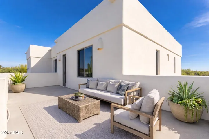 Elegant outdoor living space enhanced by vibrant skies.