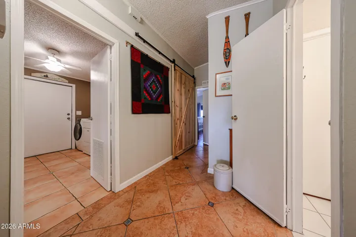 Hallway to laundry room and door to Arizona Room