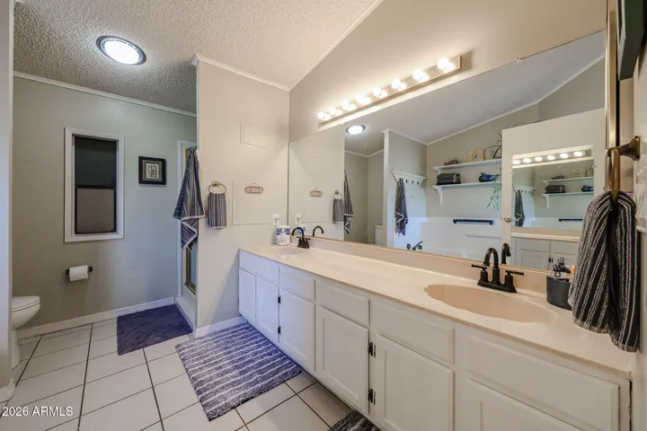 Master bath has 2 sinks and shower and tub