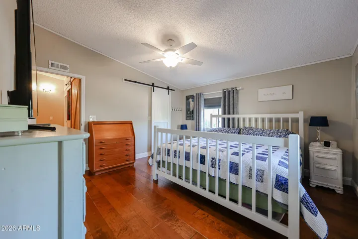 Master bedroom with barn door on closet