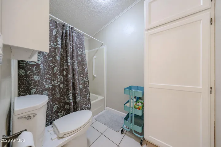 Hall bath has separate tub/shower combo and toilet area.