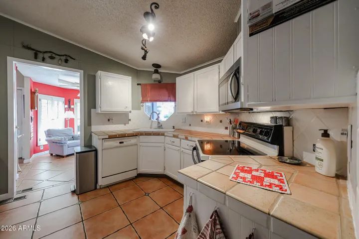 Kitchen opens to dining room on left