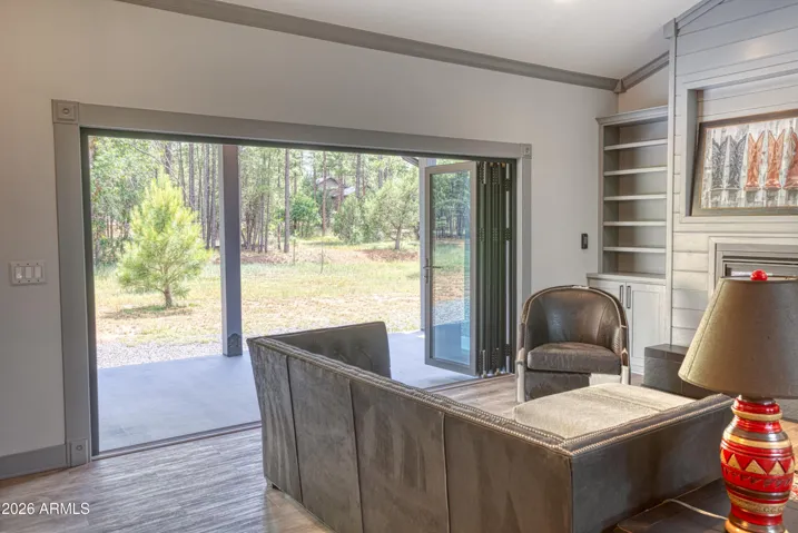 Paneled Doors open to include outdoor living.