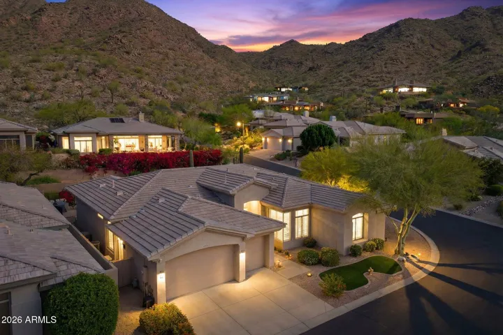 Elevated Twilight Perspective Capturing the Home's Setting Against the Mountain Backdrop