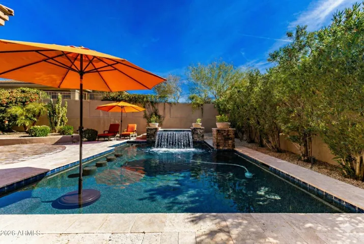 Virtually-staged: Additional umbrella in corner of the pool