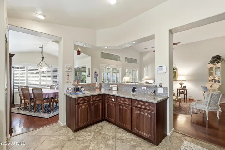 Separated kitchen remains open to living area with breakfast bar.