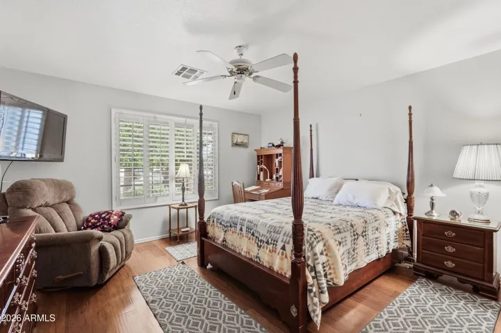 Second bedroom with ensuite tucked into front of home, away from public areas and primary bed.