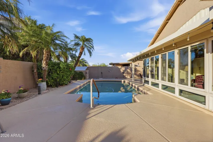 Looking north over pool with AZ room to right.