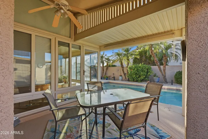 Exterior patio dining area that shade primary bed from direct sun.