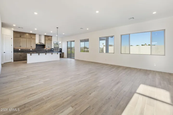 SEAMLESS WOOD PLANK TILE FLOORING THROUGHOUT MINUS THE BEDROOMS. 10' CELINGS, 8 ' INTERIOR DOORS
